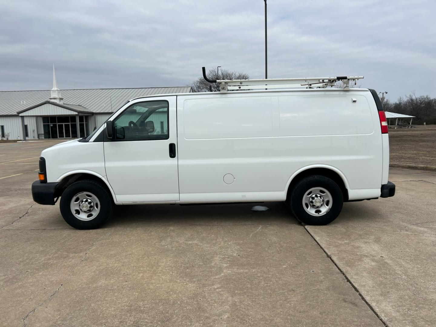 2012 White /Gray Chevrolet Express 2500 Cargo (1GCWGFCB4C1) with an 6.0L V8 OHV 16V FFV engine, 6-Speed Automatic transmission, located at 17760 Hwy 62, Morris, OK, 74445, (918) 733-4887, 35.609104, -95.877060 - 2012 CHEVROLET EXPRESS CARGO VAN 6.0L V8 RWD FEATURING MANUAL LOCKS, MANUAL WINDOWS, MANUAL MIRRORS, MANUAL SEATS, AM/FM STEREO, LEATHER SEATS, LEATHER-WRAPPED STEERING WHEEL, TRACTION CONTROL, LOCKING METAL CONSOLE, STEEL SHELVES, SPLIT SWING-OUT RIGHT DOORS, RUBBER MATS, LOAD-BEARING EXTERIOR RACK - Photo#7